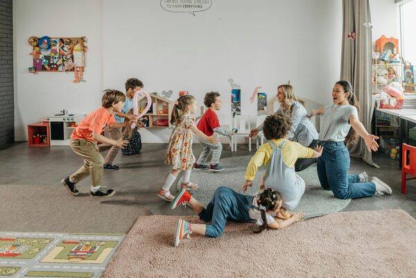 Caregiver engaging with young children